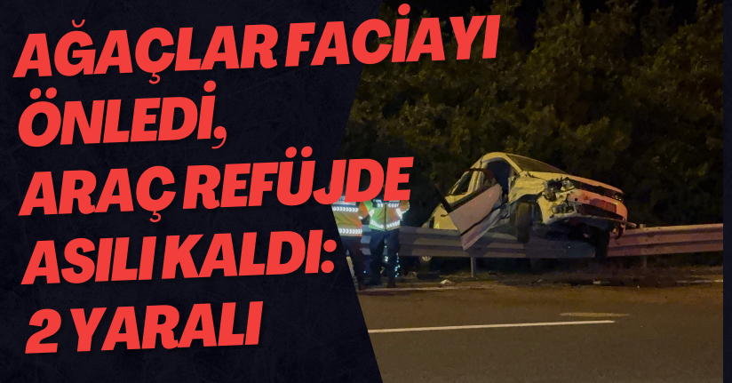 Ağaçlar Faciayı Önledi, Araç Refüjde Asılı Kaldı: 2 Yaralı