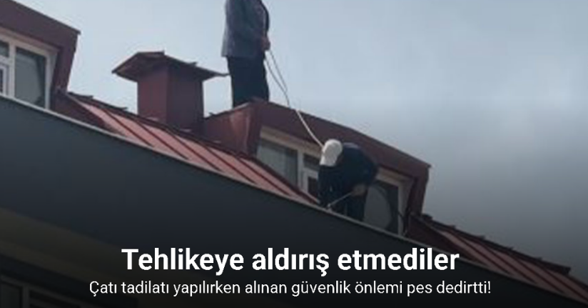 Çatı tadilatı yapan işçi beline ip bağlayarak güvenlik önlemi aldı