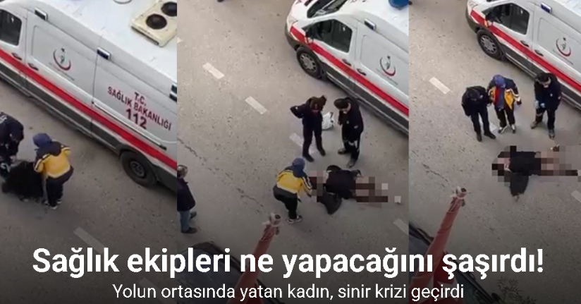 Yolun ortasında yatan kadın, sinir krizi geçirdi