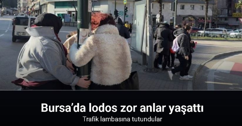 Bursa’da lodos zor anlar yaşattı: trafik lambasına tutundular