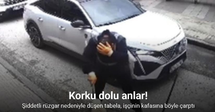 Şiddetli rüzgar nedeniyle düşen tabela, işçinin kafasına böyle çarptı