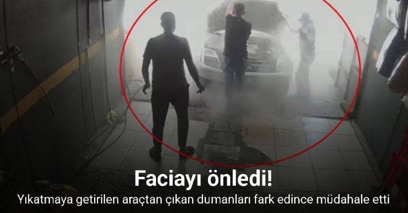 Yıkatmaya getirilen araçtan çıkan dumanları fark eden çalışanın hızlı müdahalesi aracı yanmaktan kurtardı